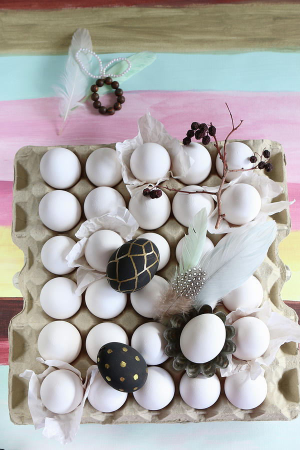 Painted Eggs, Feathers And Twig On Crate Of White Eggs Photograph by Regina Hippel