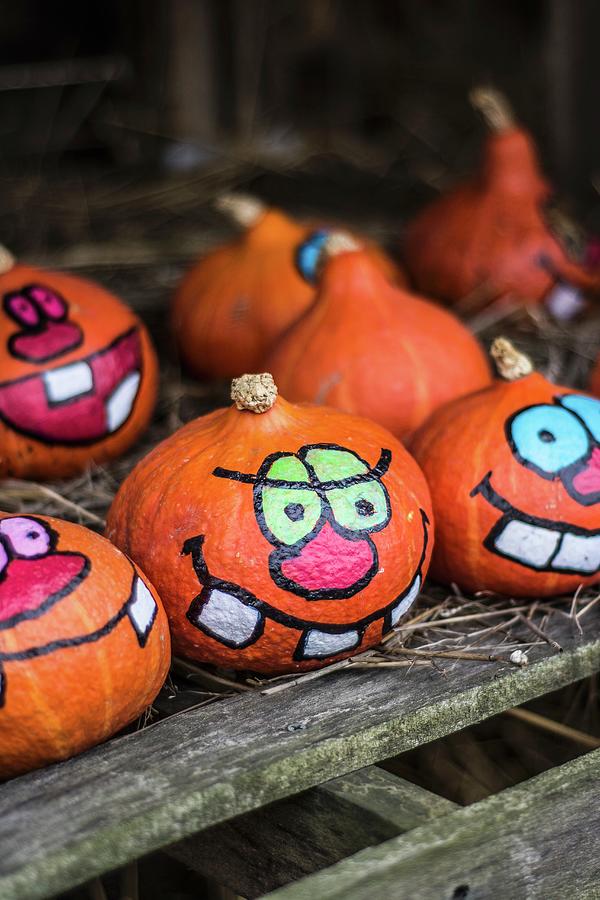 Painted Halloween Pumpkins On A Farm Photograph by Adriana Baran