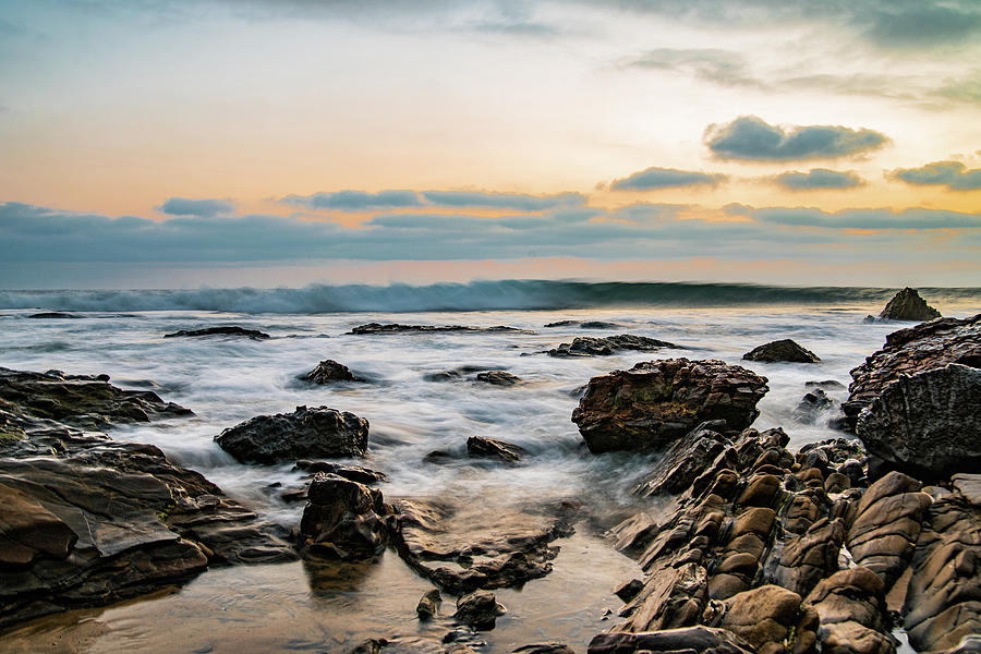 Painted waves on rocky beach sunset Photograph by Local Snaps Photography