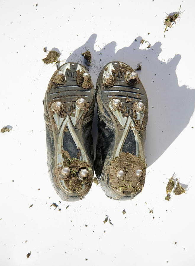Pair Of Muddy Football Boots - Studs Photograph by Ashley Jouhar
