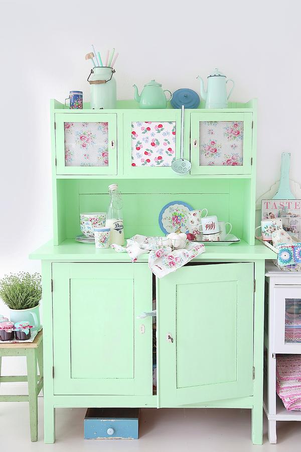 Pale Green, Vintage Kitchen Dresser Romantically Decorated With Pastel Enamel Crockery, Rose-patterned China And Floral Fabrics Photograph by Syl Loves