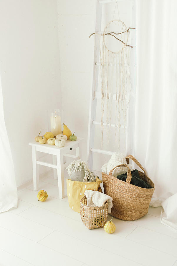 Pale, Modern, Autumn Arrangement Of Pumpkins, Ladder On Wall, Dreamcatcher And Baskets Photograph by Katja Heil