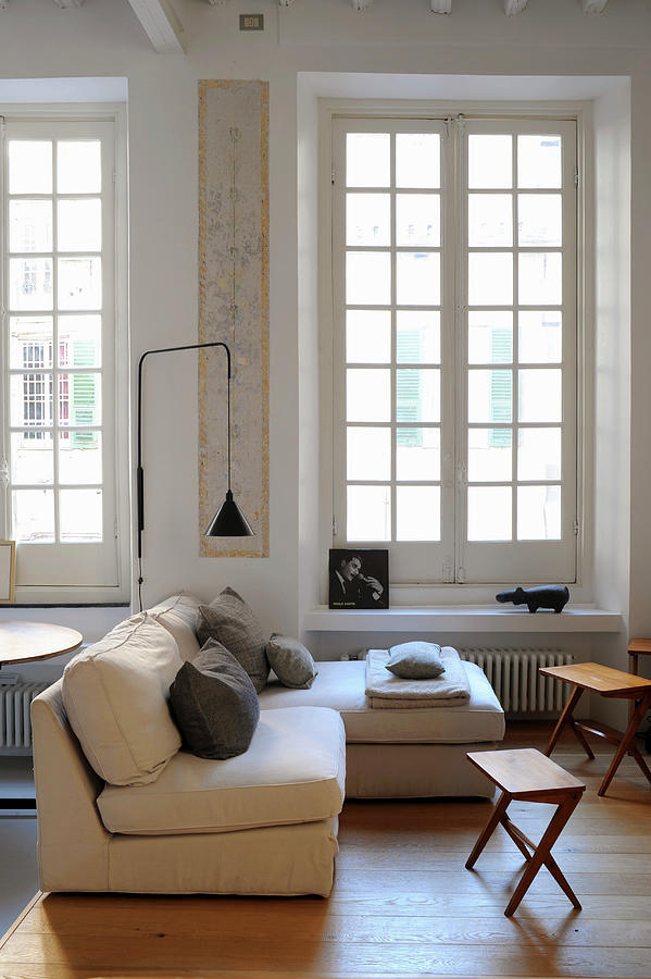 Pale Sofa, Side Tables And Standard Lamp In Front Of Lattice Windows In Period Apartment Photograph by Michele Mulas