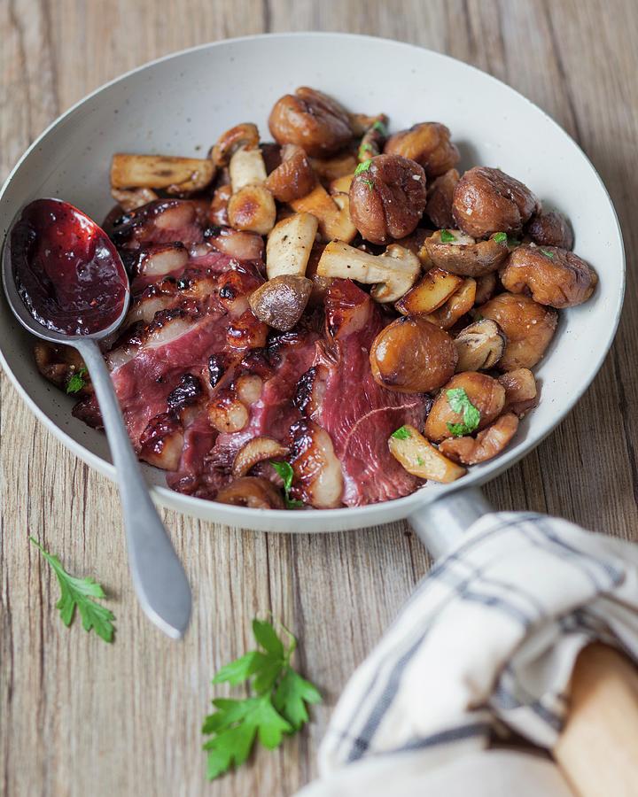 Pan-fried Duck Fillets With Cranberry Coulis, Mixed Mushrooms With Chestnuts Photograph by Garnier