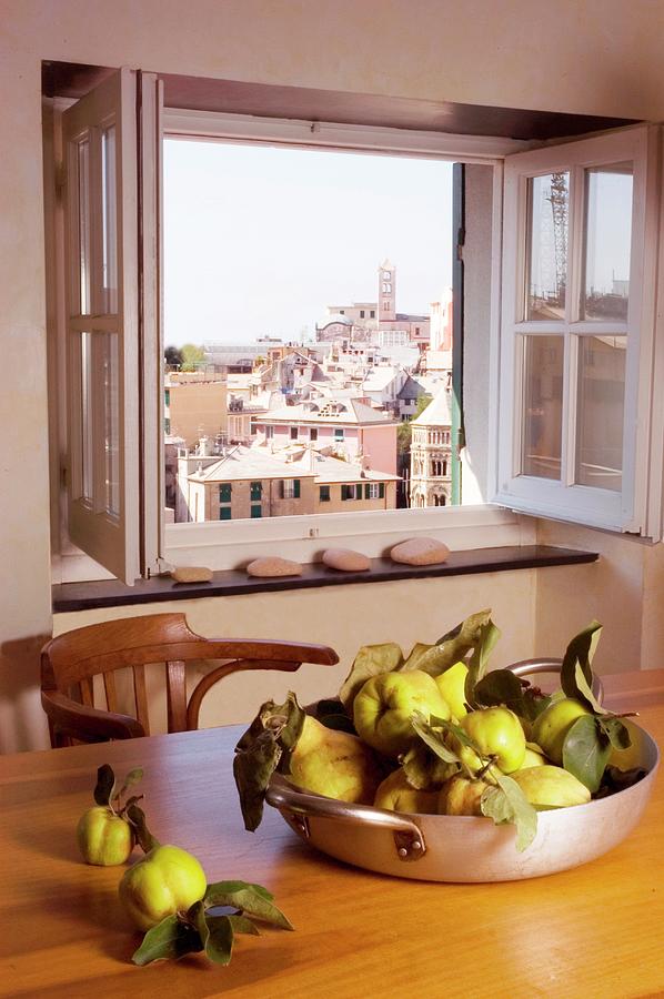 Pan Holding Quinces And View Of City Through Window Photograph by Michele Mulas