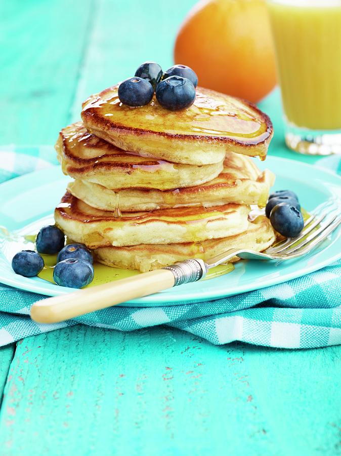 Pancake Stack With Maple Syrup And Blueberries And Orange Juice Photograph by Artfeeder