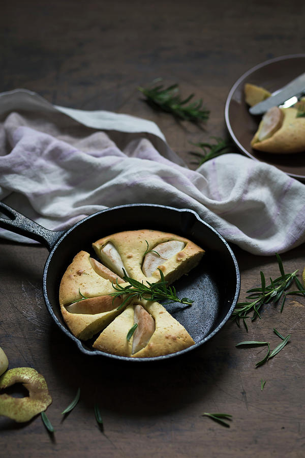 Pancake With Pears And Rosemary, Baked In A Cast Iron Skillet Photograph by Malgorzata Laniak