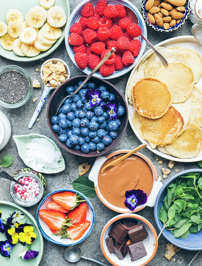 Pancakes And An Assortment Of Toppings Photograph by Velsberg