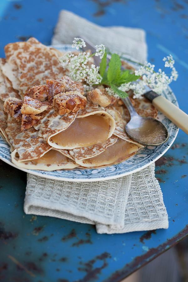 Pancakes Filled With Apple Sauce On Vintage-style Plate Photograph by Martina Schindler