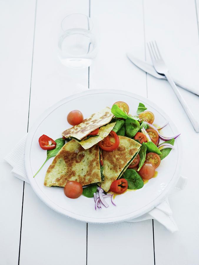 Pancakes Filled With Baby Spinach And Tomatoes Photograph by Mikkel Adsbl