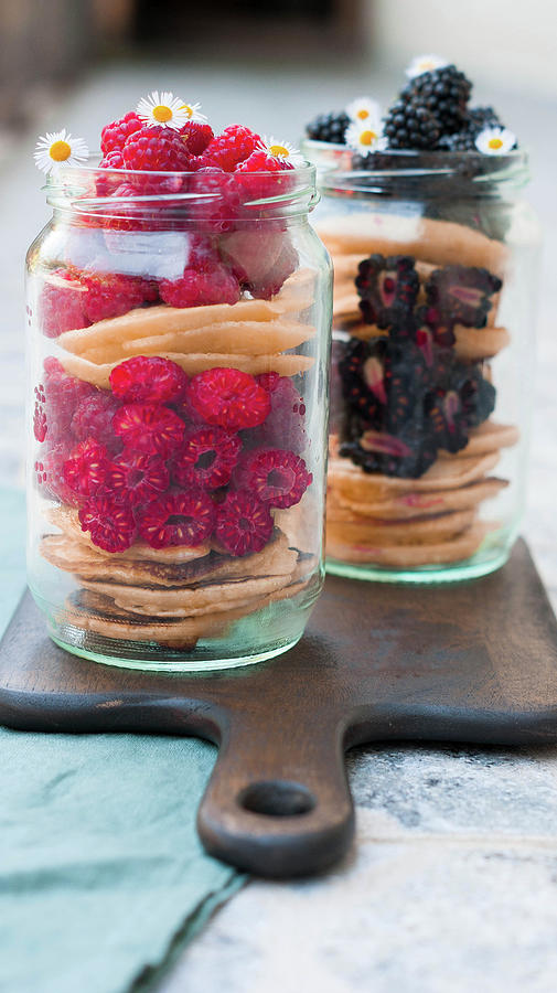 Pancakes Layered With Raspberries And Blackberries In Screw-top Jars Photograph by Elena Ecimovic