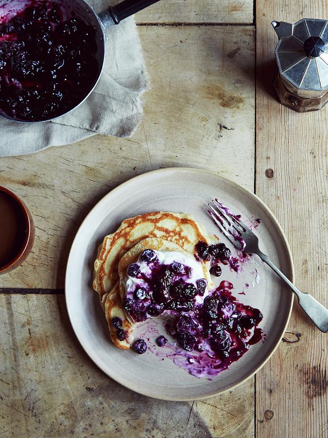 Pancakes With Blueberries, Plain Yoghurt, Honey And Pumpkin Seeds Photograph by Lukejalbert