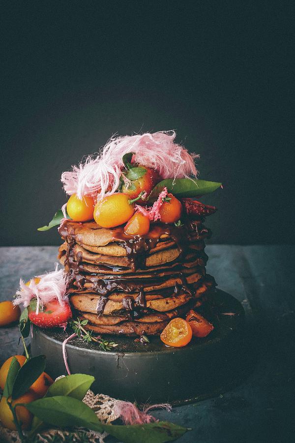Pancakes With Chocolate Sauce And Poached Kumquats Photograph by Ghosh