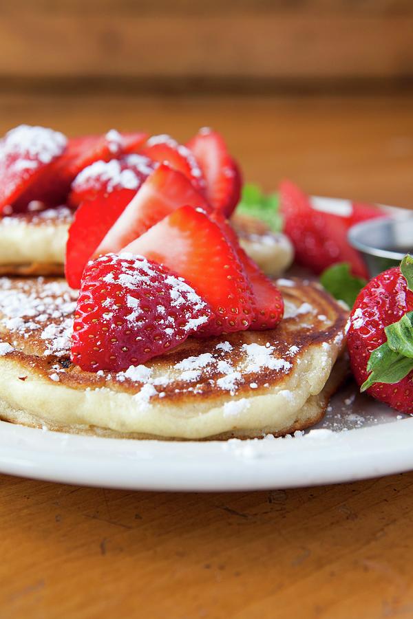 Pancakes With Icing Sugar And Strawberries Photograph by Amy Kalyn Sims