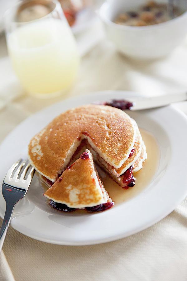 Pancakes With Maple Syrup And Berry Jam Photograph by Imagerie