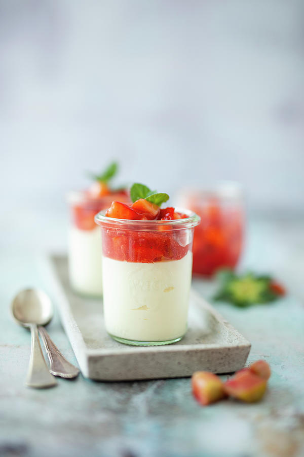 Panna Cotta In A Glass With Compote Made From Strawberries And Rhubarb Photograph by Jan Wischnewski