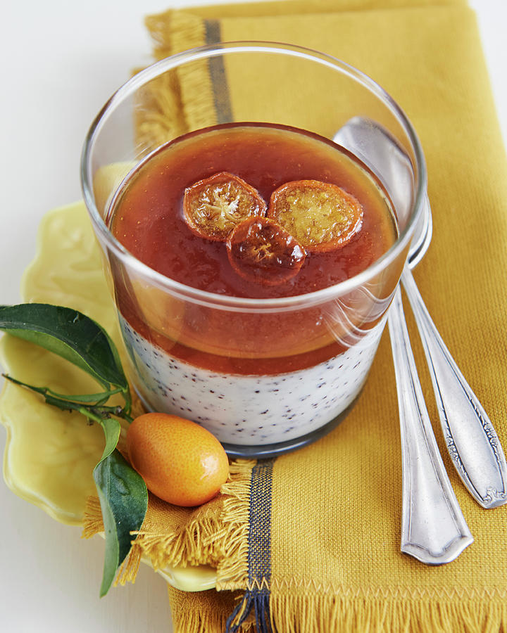 Panna Cotta In A Glass With Poppyseeds, Orange Jelly And Candied Kumquats Photograph by Hannah Kompanik