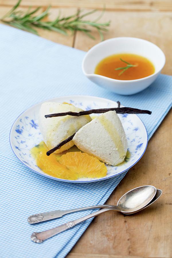 Panna Cotta With A Rosemary And Orange Sauce Photograph by Claudia Timmann
