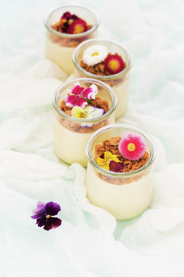 Panna Cotta With Amaretti Crumbs And Edible Flowers Photograph by Aniko Takacs