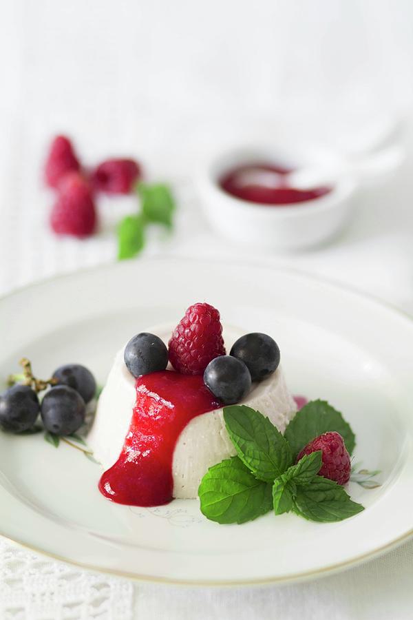 Panna Cotta With Fresh Raspberry Sauce And Red Grapes Photograph by Alicia Maas Aldaya