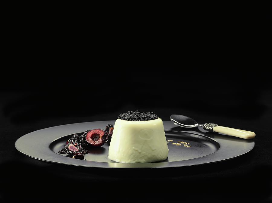 Panna Cotta With Poppyseeds And Cherries Photograph by Christian Schuster