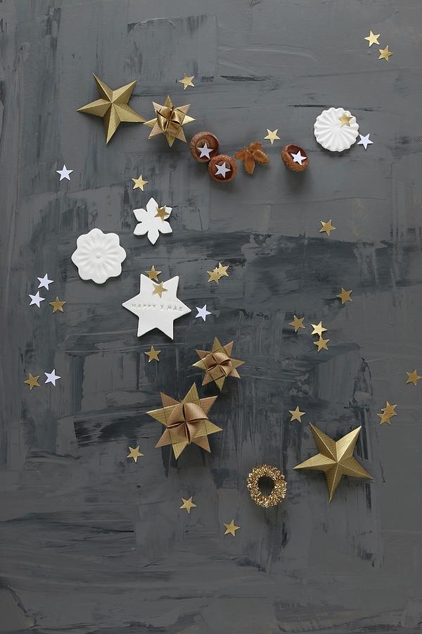 Paper And Modelling Clay Stars On Black Surface Photograph by Regina Hippel