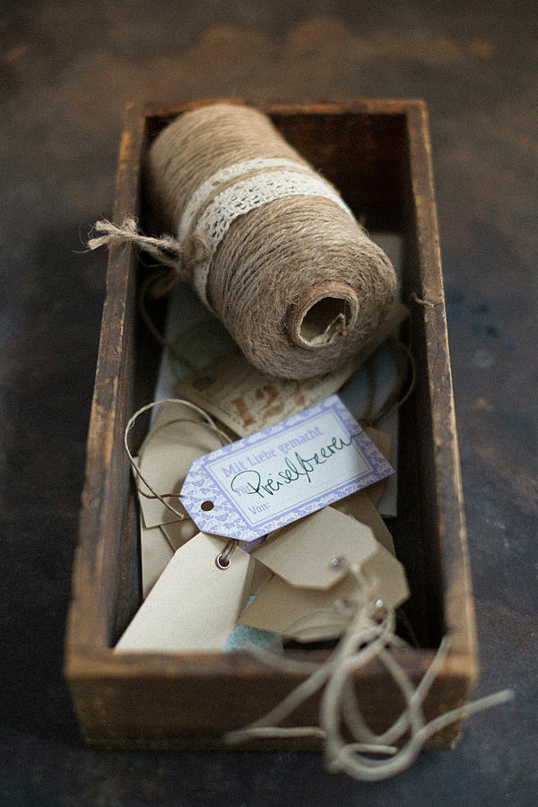 Paper And Twine Gift Tags In Wooden Box Photograph by Eising Studio