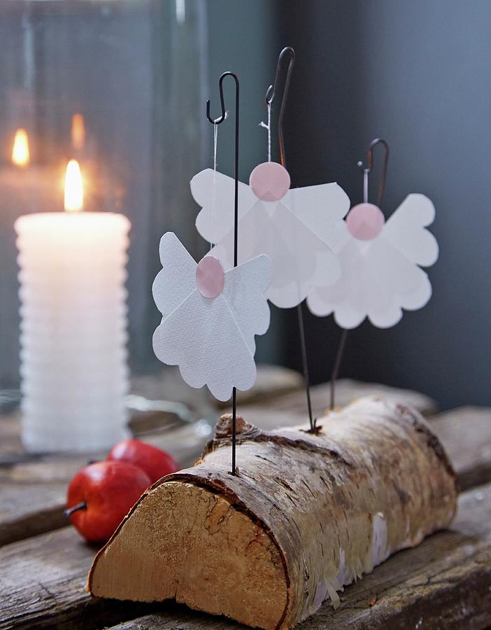 Paper Angels On Wire Hooks Stuck In Birch Log Photograph by Martin Slyst