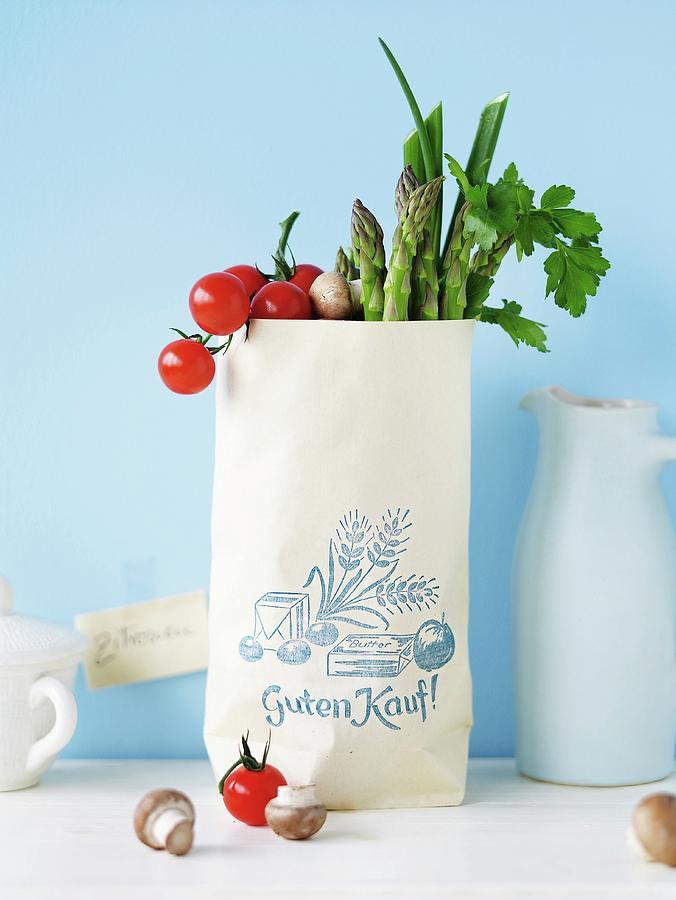 Paper Bag Filled With Vegetables Photograph by Jalag / Janne Peters