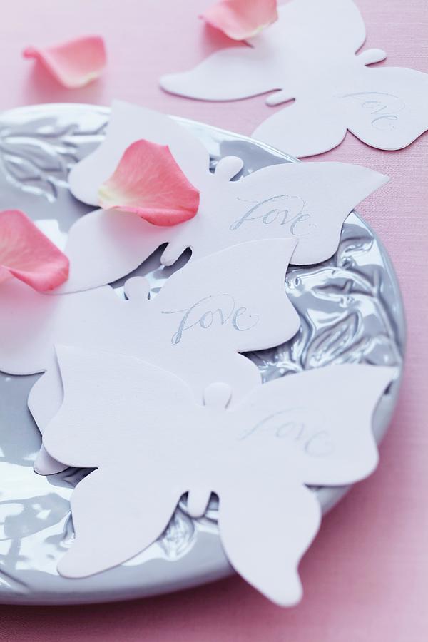 Paper Butterflies & Rose Petals Decorating Table Photograph by Franziska Taube