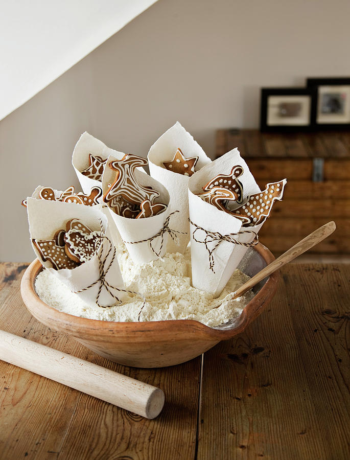 Paper Cones Of Decorated Gingerbread Biscuits In Bowl Photograph by Lykke Foged & Morten Holtum