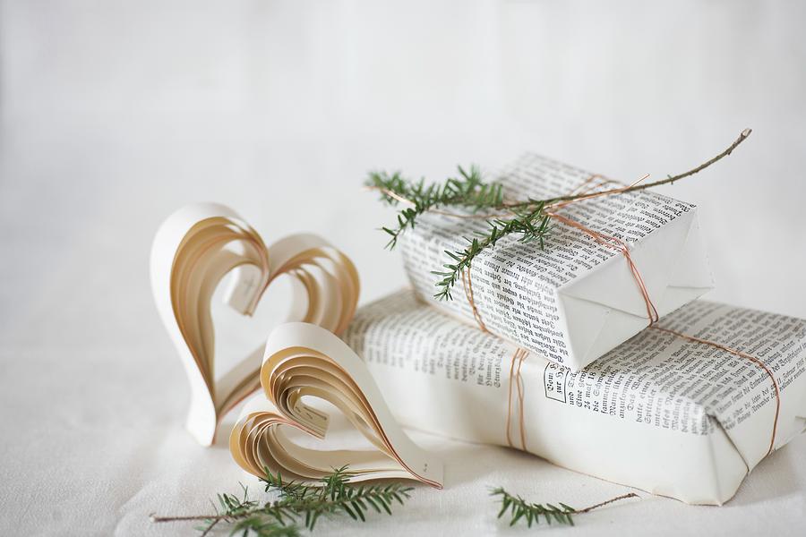 Paper Hearts And Gift Wrapped In Book Pages Photograph by Alicja Koll