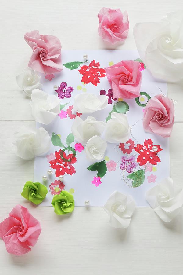 Paper Roses On Paper Printed With Flowers Photograph by Regina Hippel