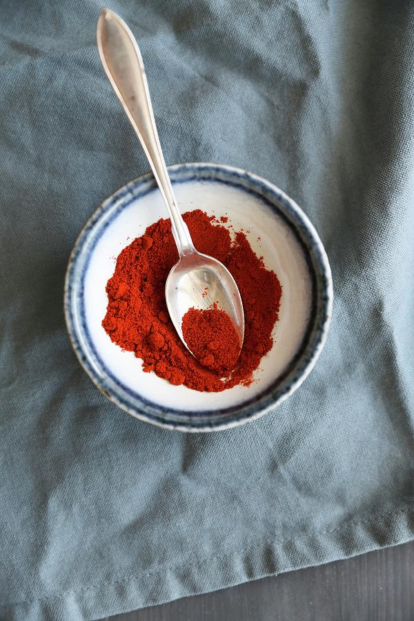 Paprika Powder In A Bowl With A Spoon Photograph by Eva Lambooij