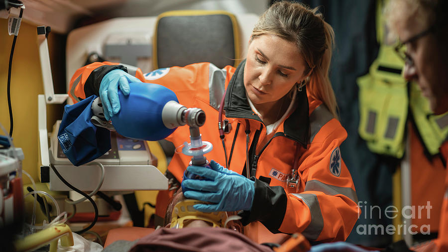 Paramedic Team Providing Medical Help To Injured Patient Photograph By