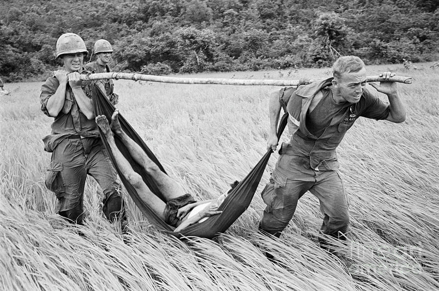 Paratroopers Rush Prisoner To Helicopter Photograph by Bettmann Paratroopers Rush Prisoner To Helicopter Photograph by Bettmann