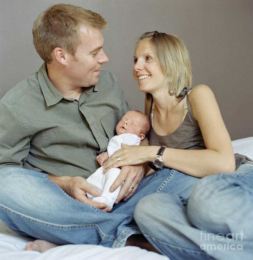 Parents And Newborn Baby Photograph by Cecilia Magill/science Photo Library