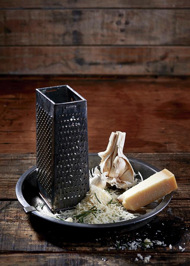 Parmesan, Rosemary, Garlic And A Grater Photograph by Great Stock!
