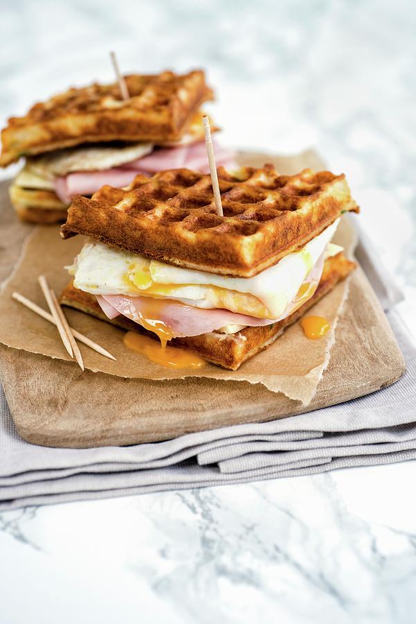 Parmesan Waffles With Ham, Cheese And Fried Egg Photograph by Lucy Parissi