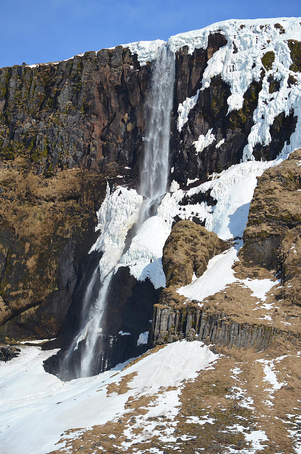 Partially Frozen Waterfall Cascading Over Volcanic Basalt Cliff Photograph by Shawn OBrien