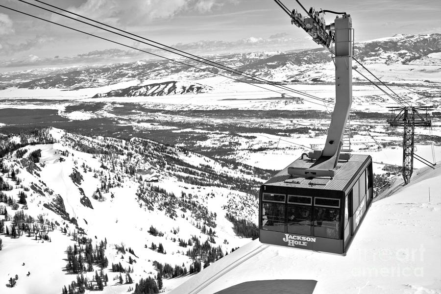 Partly Cloudy Skies Over The Jackson Hole Tram Black And White Photograph by Adam Jewell