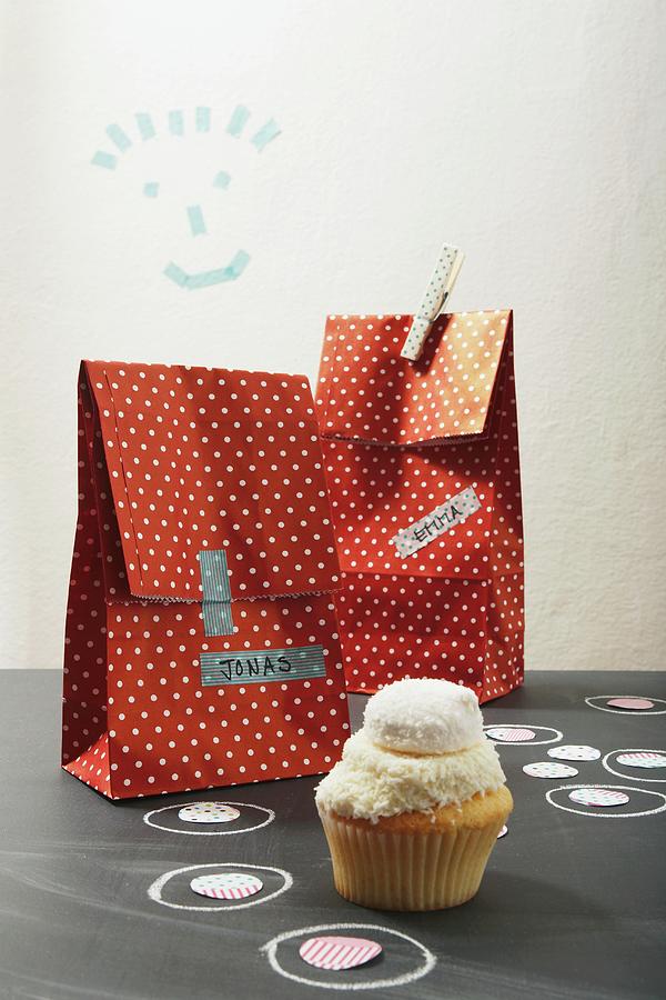 Party Loot Bags With Name Tags And One Cupcake Photograph by Heidi Frhlich