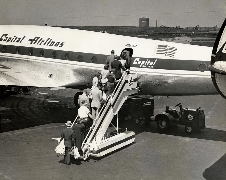 Passengers Boarding Airplane Photograph by George Marks