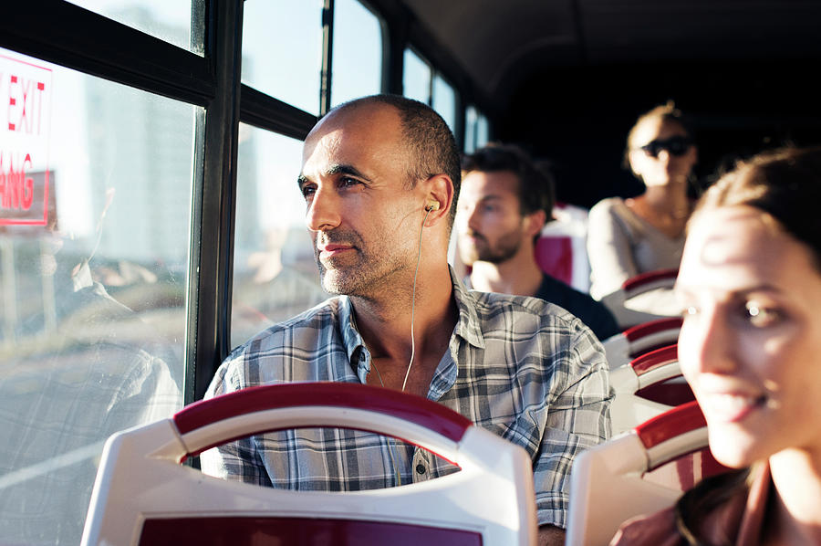 Passengers Looking Through Window While Traveling In Bus Photograph by ...