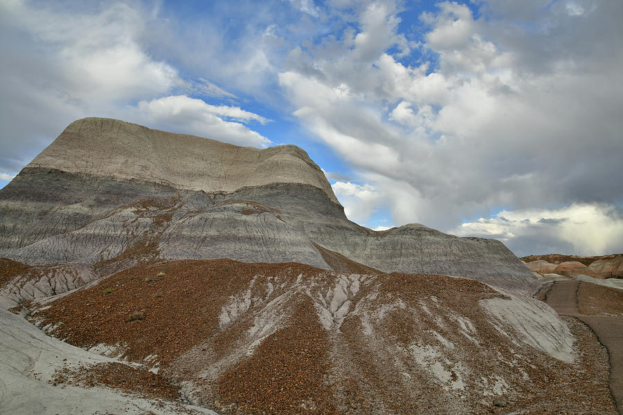 Passing Evening Clouds over Blue Mesa Photograph by Ray Mathis