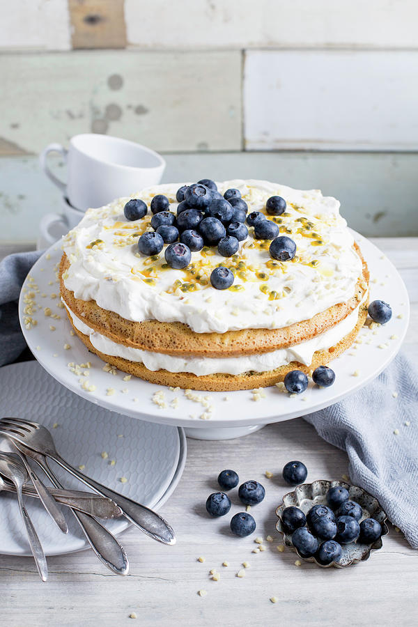 Passion Fruit And Blueberry Cake With Cream Photograph by Claudia Timmann