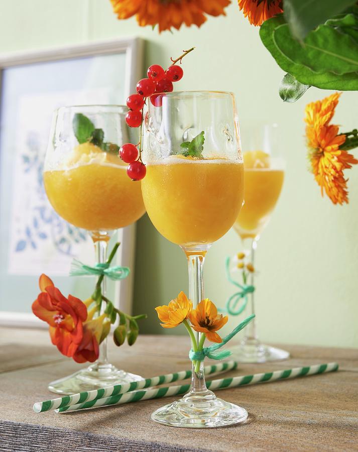 Passion Fruit Daiquiri Garnished With Flowers Photograph by Jan-peter Westermann