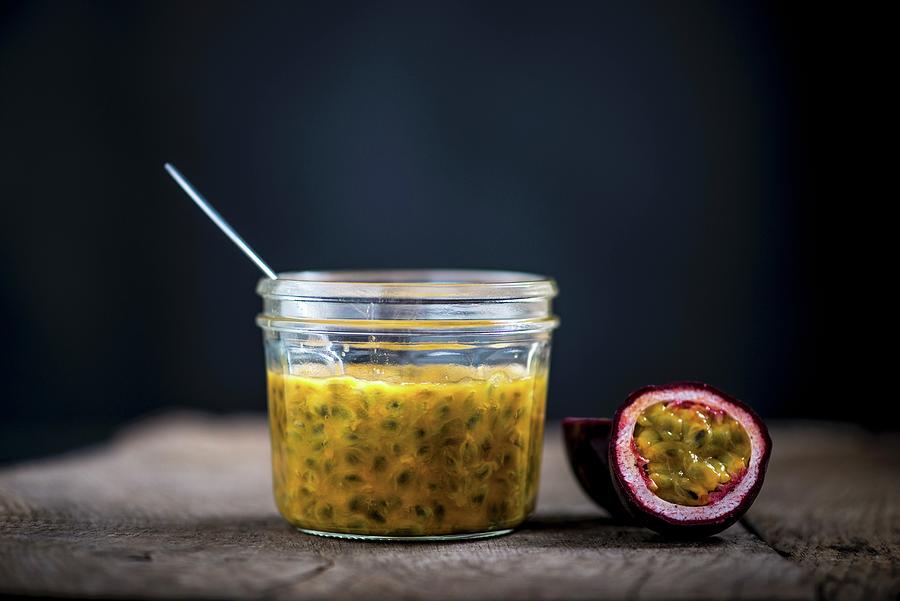 Passion Fruit Sauce And A Halved Passion Fruit Photograph by Nitin Kapoor