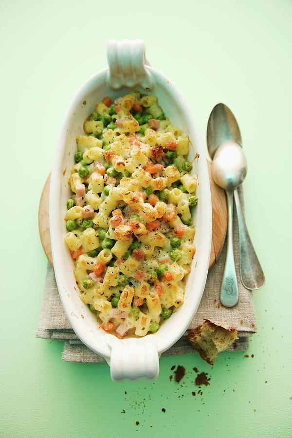 Pasta Gratin With Peas And Ham Photograph by Michael Wissing