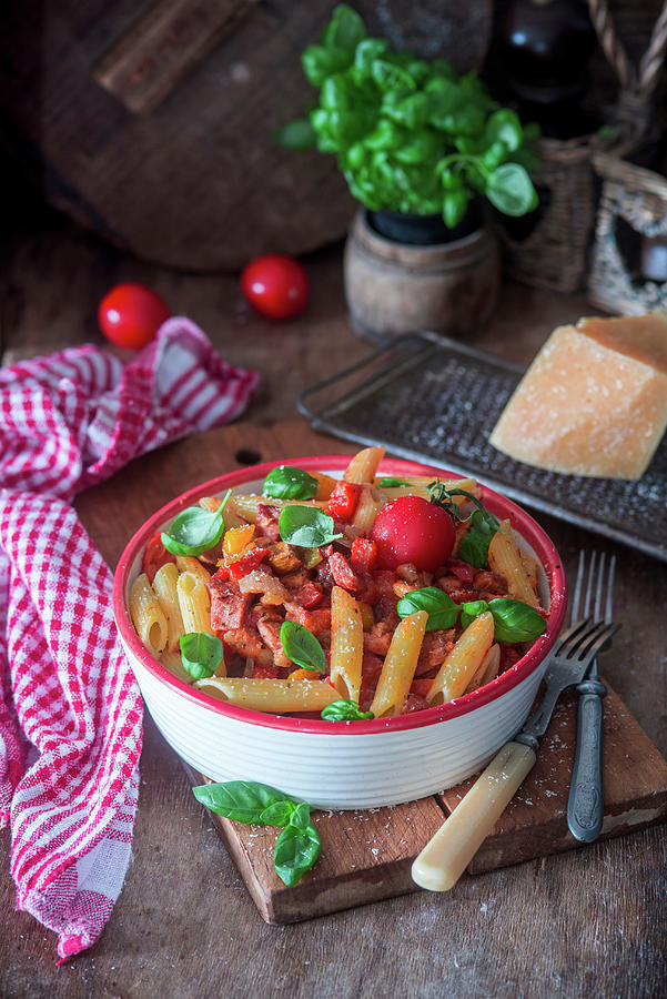 Pasta Penne With Pepper, Tomato Sauce And Bacon Photograph by Irina Meliukh